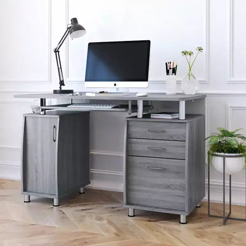 Scrivania da computer grigia con ripiano per tastiera, cassetti e schedario, singola